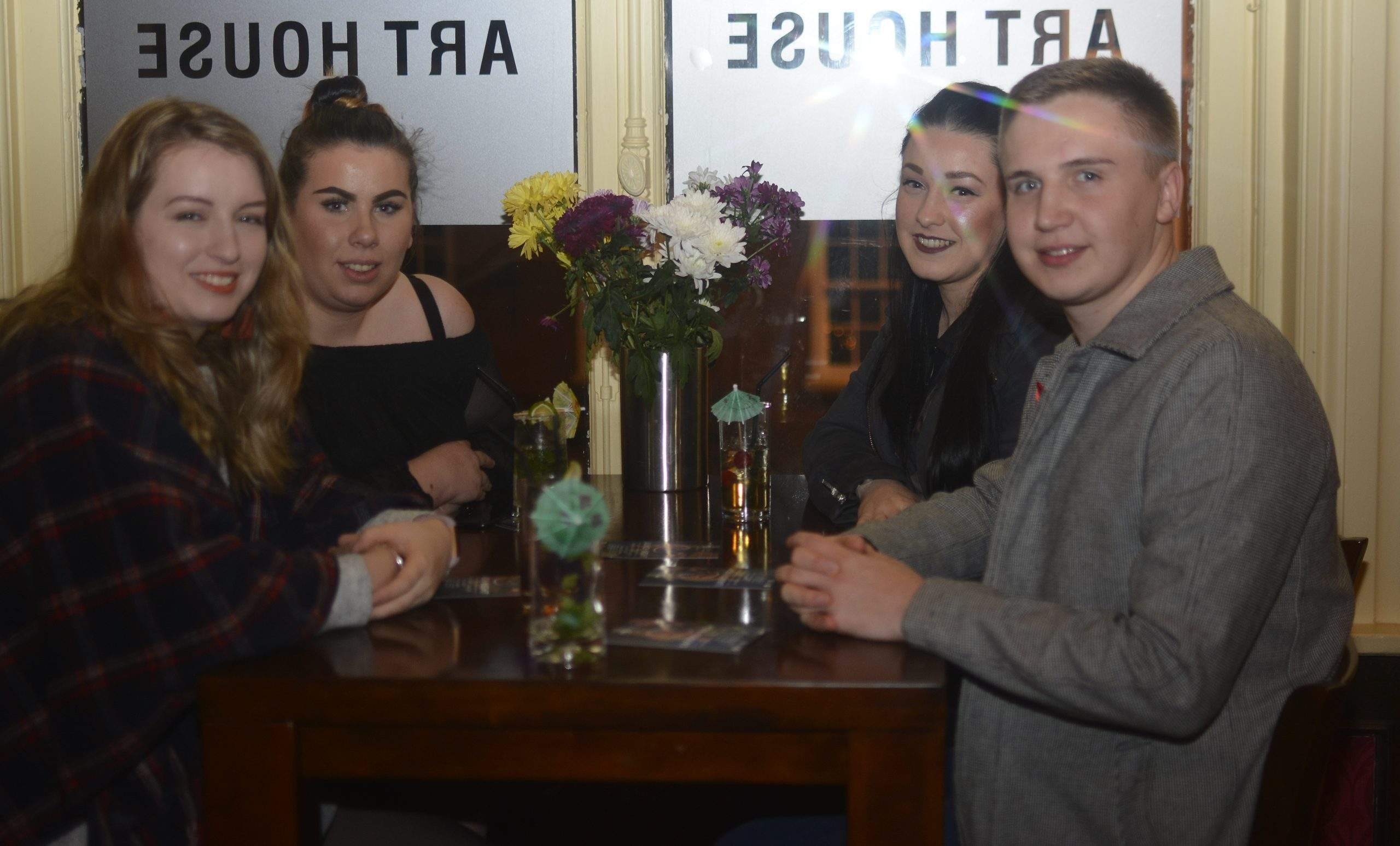 4 participants at YADA's sober party event smiling at the camera